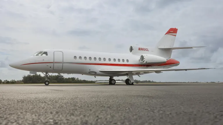 Dassault Falcon 900B parked on tarmac. 