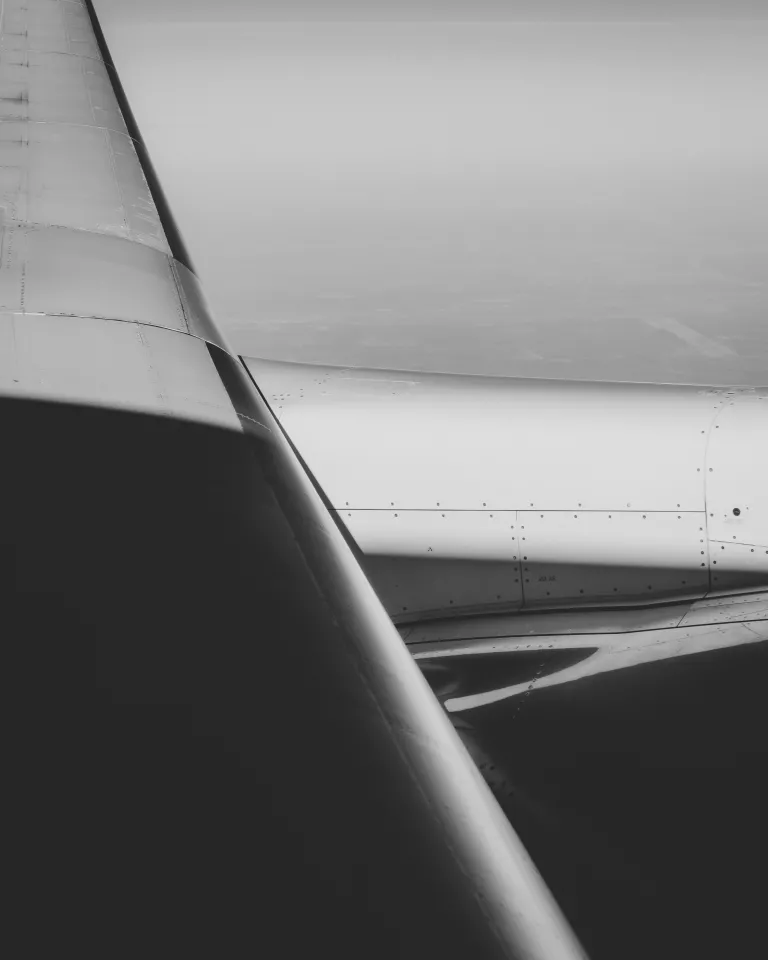 A tightly-cropped, back and white image of a private aircraft.