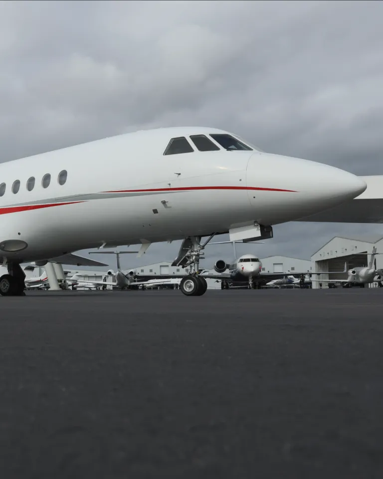 Dassault Falcon 900B parked on tarmac.