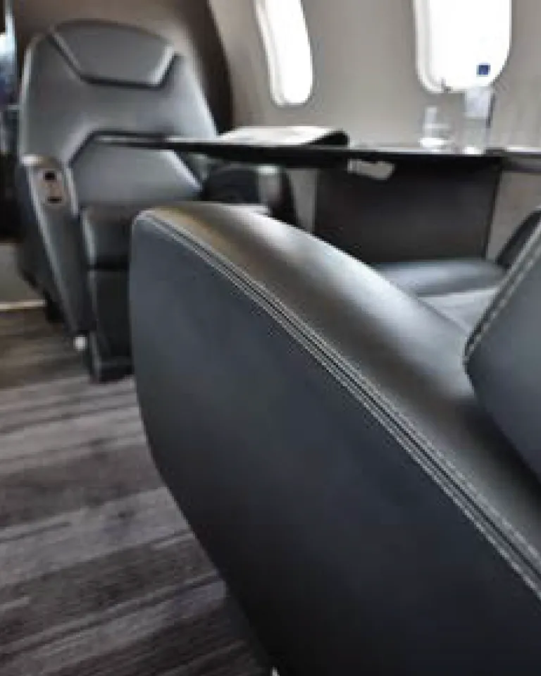Bombardier Challenger 300 interior seat close-up.